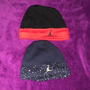 Two Jordan baby hats